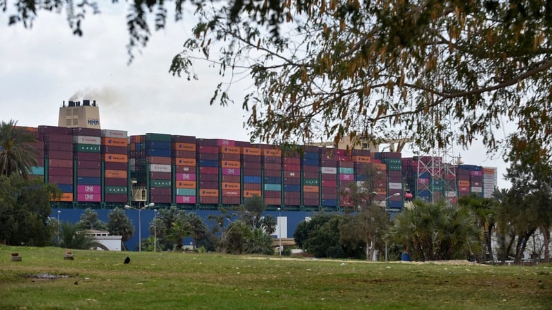 A container ship navigates Egypt's Suez Canal after the Ever Given cargo vessel was dislodged from its banks