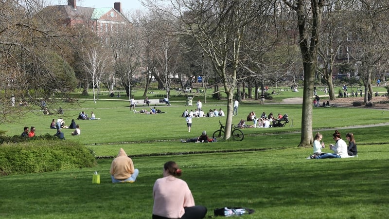 People enjoy the spring sunshine in Dublin's Merrion Park