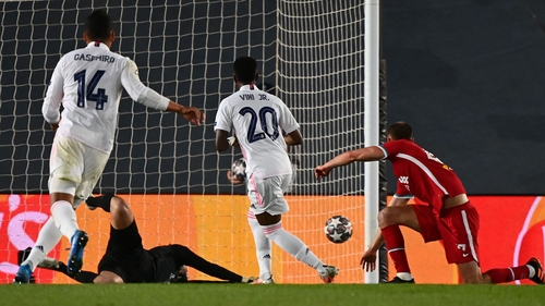 Vinicius Junior (C) scores his team's third goal
