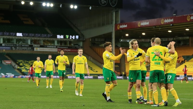 Teemu Pukki is mobbed after scoring his team's second goal