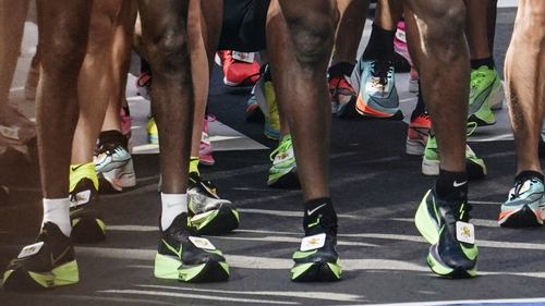 Athletes wearing Nike thick-soled shoes run at the 2020 Tokyo Marathon