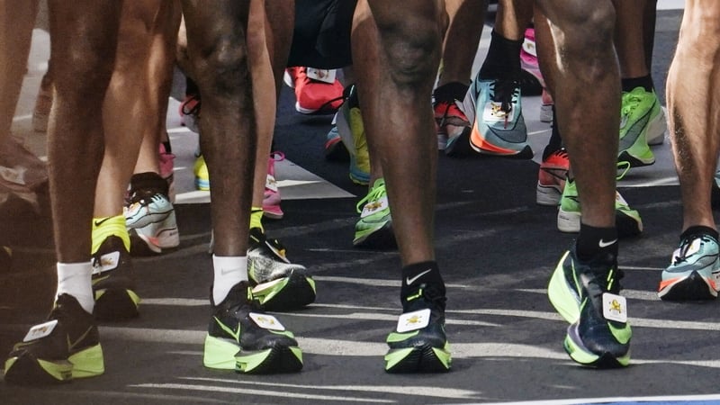 Athletes wearing Nike thick-soled shoes run at the 2020 Tokyo Marathon
