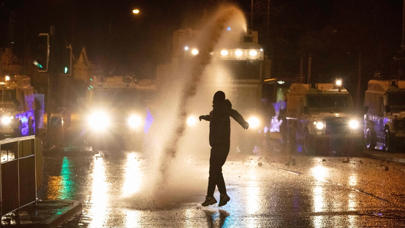 PSNI use a water cannon on the Springfield Road, during further unrest in Belfast