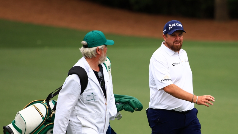 Lowry of Ireland and his caddie Brian Martin