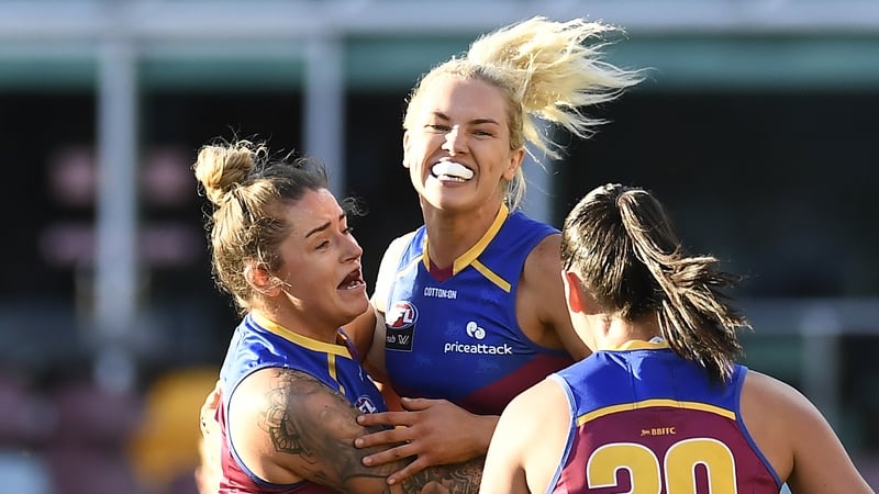 Orla O'Dwyer celebrates a goal with her Lions team-mates