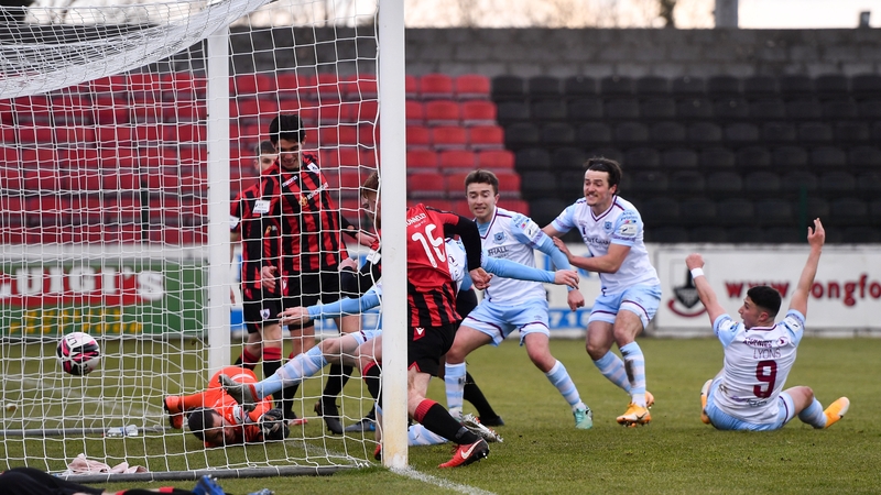 Drogheda's Mark Doyle (hidden) scores his side's first goal.