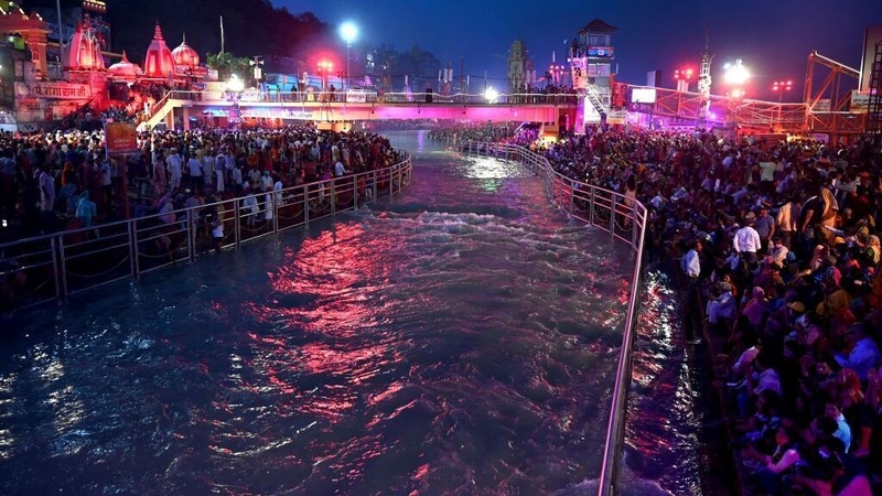 Despite the pandemic, Hindu devotees gather on the banks of the Ganges River during a religious festival in India