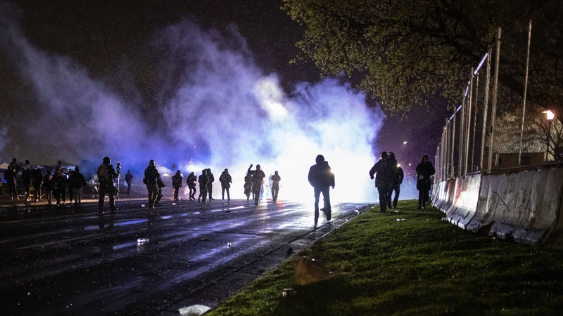 Protesters clash with police in front of the police station in Brooklyn Center, Minneapolis