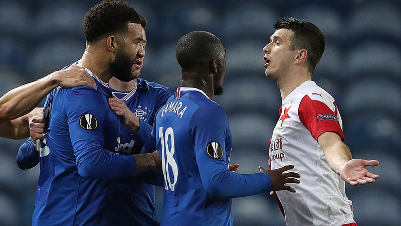 Connor Goldson (L) and Glen Kamara of Rangers clash with Ondrej Kudela