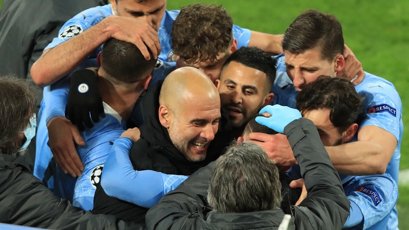 Pep Guardiola celebrates with his players after Phil Foden's decisive goal