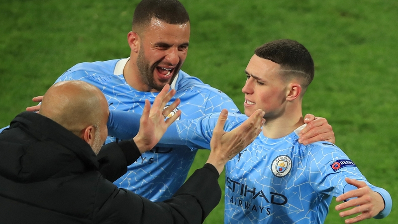 Phil Foden celebrates scoring City's second goal on the night with manager Pep Guardiola and team-mate Kyle Walker