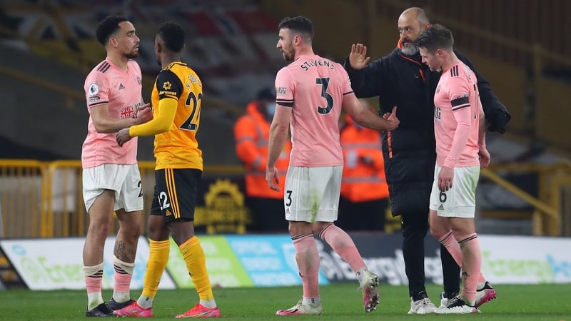 Wolves manager Nuno Espirito Santo consoles Enda Stevens at the final whistle