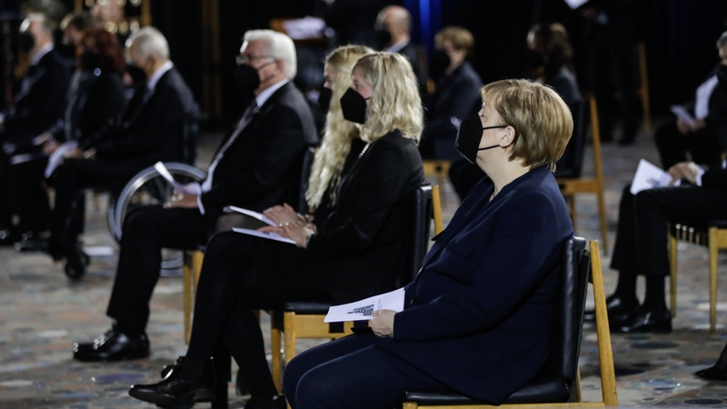 German President Frank-Walter Steinmeier (L) and German Chancellor Angela Merkel (R) at the morning service