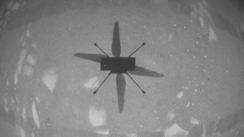 A handout image from NASA shows the shadow of the Ingenuity helicopter during its first test flight on Mars
