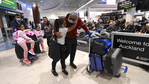 Passengers arriving at Auckland airport after a flight from Australia