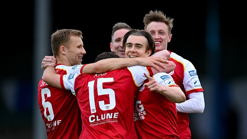 Matty Smith, second from right, is mobbed after his goal