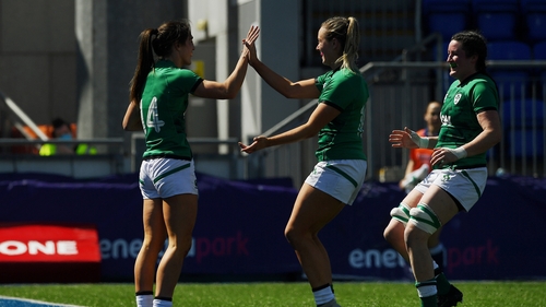 Amee Leigh Murphy-Crowe celebrates her first try with team-mates Stacey Flood and Hannah O'Connor