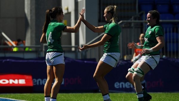 Amee Leigh Murphy-Crowe celebrates her first try with team-mates Stacey Flood and Hannah O'Connor