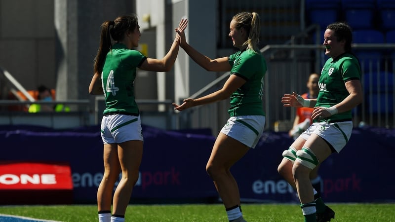 Amee Leigh Murphy-Crowe celebrates her first try with team-mates Stacey Flood and Hannah O'Connor