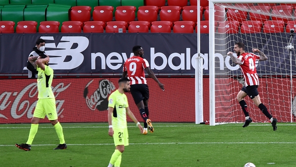 Inigo Martinez of Bilbao celebrates his winning goal with teammate Inaki William