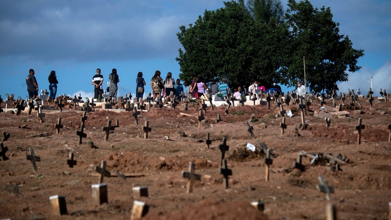 People attend a funeral at a cemetery in Rio de Janeiro, Brazil amid the Covid-19 pandemic.