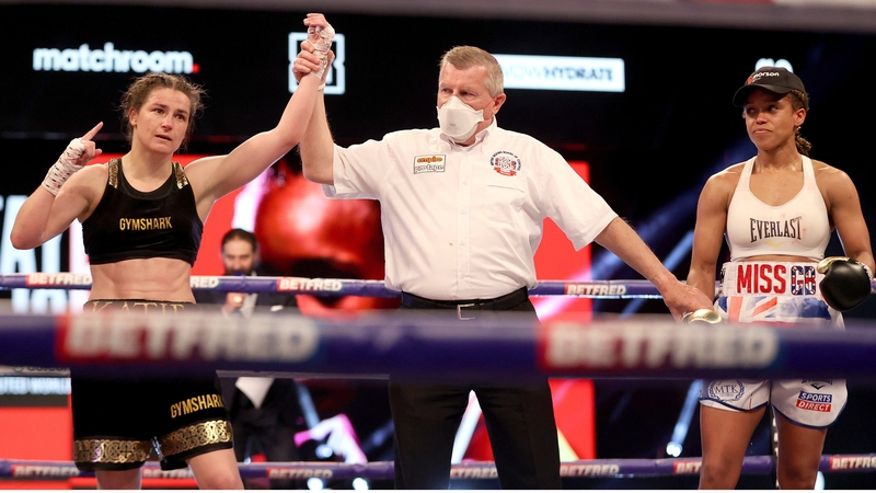 Katie Taylor has her arm raised in victory