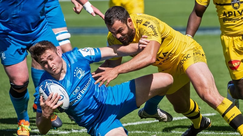 Jordan Larmour (L) is challenged by La Rochelle's French centre Geoffrey Doumayrou