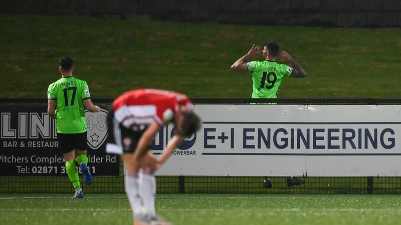 Adam Foley (19) celebrates after finding the net