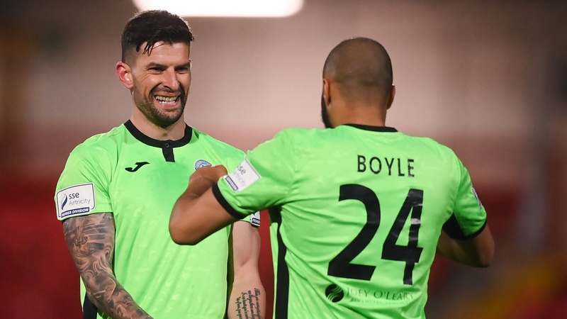 Adam Foley, left, and Ethan Boyle celebrate after beating Derry City