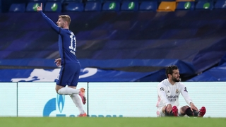 Timo Werner celebrates his goal as Real Madrid defender Nacho looks on