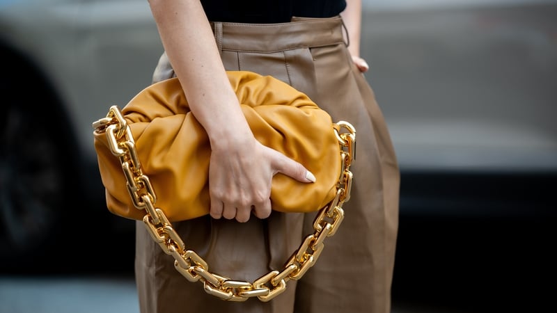 Justyna Czerniak carrying a Bottega Veneta bag during Copenhagen fashion week SS21.