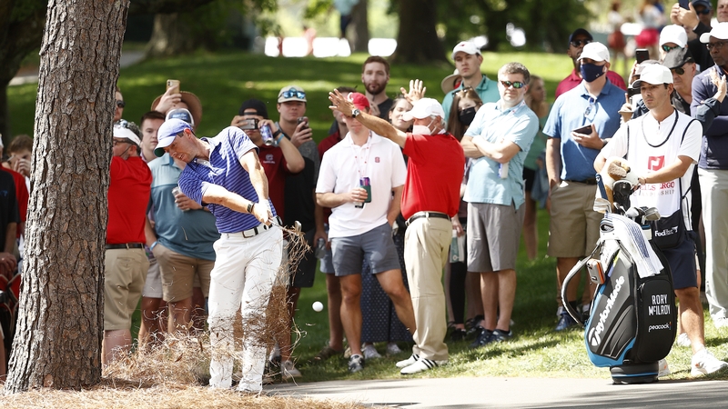 Rory McIlroy plays a tricky shot on the 10th on his first round