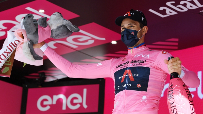 Filippo Ganna celebrates winning the pink jersey after the opening stage