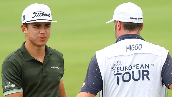 Garrick Higgo and his caddie on the 18th hole as he held a two-shot lead
