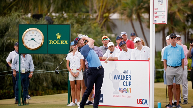 John Murphy of Team Great Britain and Ireland plays his shot from the first tee during Sunday foursomes matches