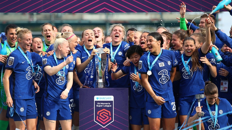 Millie Bright and Magdalena Eriksson of Chelsea lift the Barclays FA Women's Super League Trophy