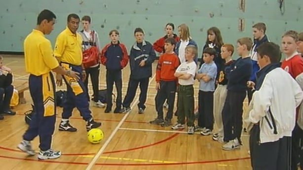 People playing football in a gym