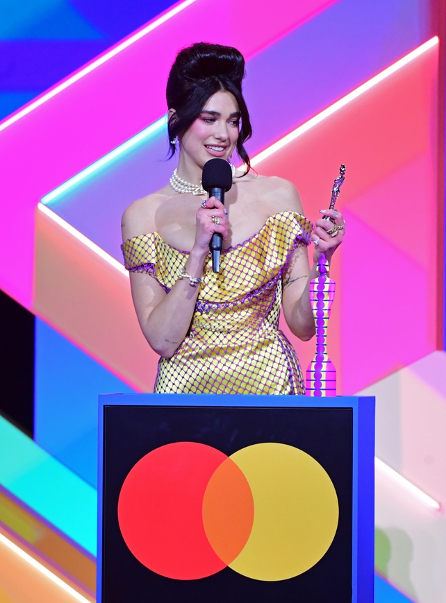 Dua Lipa accepts the award for Female Solo Artist