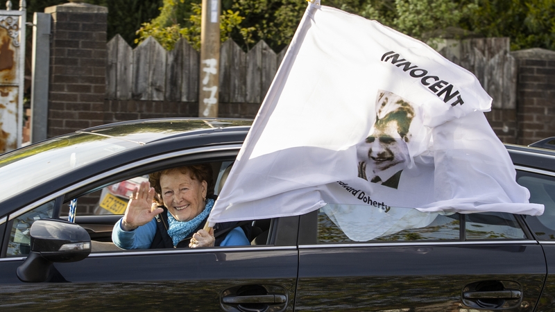 Cars beeping their horns drove through the community