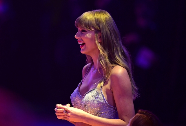 Taylor Swift watches on as Ed Sheeran, Selena Gomez and Annie Lennox pay tribute in a video montage