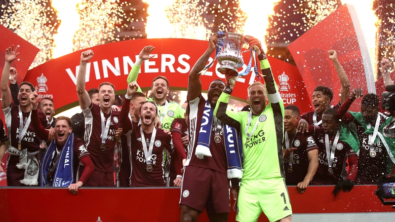 Kasper Schmeichel and Wes Morgan hoist the Cup for the first time in Leicester City's history