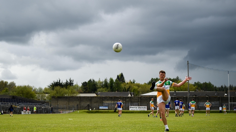 Joe Maher of Offaly kicks a free
