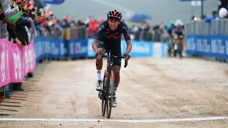 Egan Bernal hits the finish line on the gravel of Campo Felice