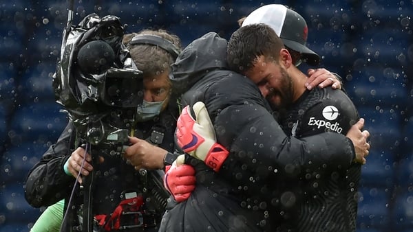 Alisson Becker and Liverpool boss Jurgen Klopp embrace after the final whistle
