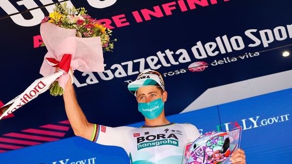 Peter Sagan celebrates on the podium after winning the 10th stage
