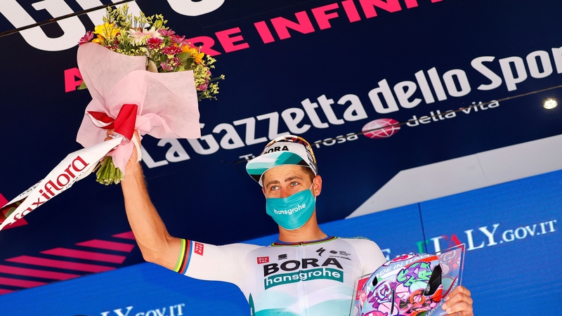 Peter Sagan celebrates on the podium after winning the 10th stage