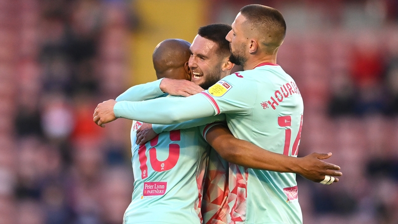 Ireland midfielder Conor Hourihane celebrates Andre Ayew's goal with Matt Grimes and the goalscorer