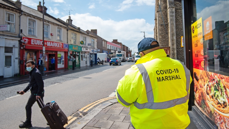 A Covid marshall on patrol in Bedford