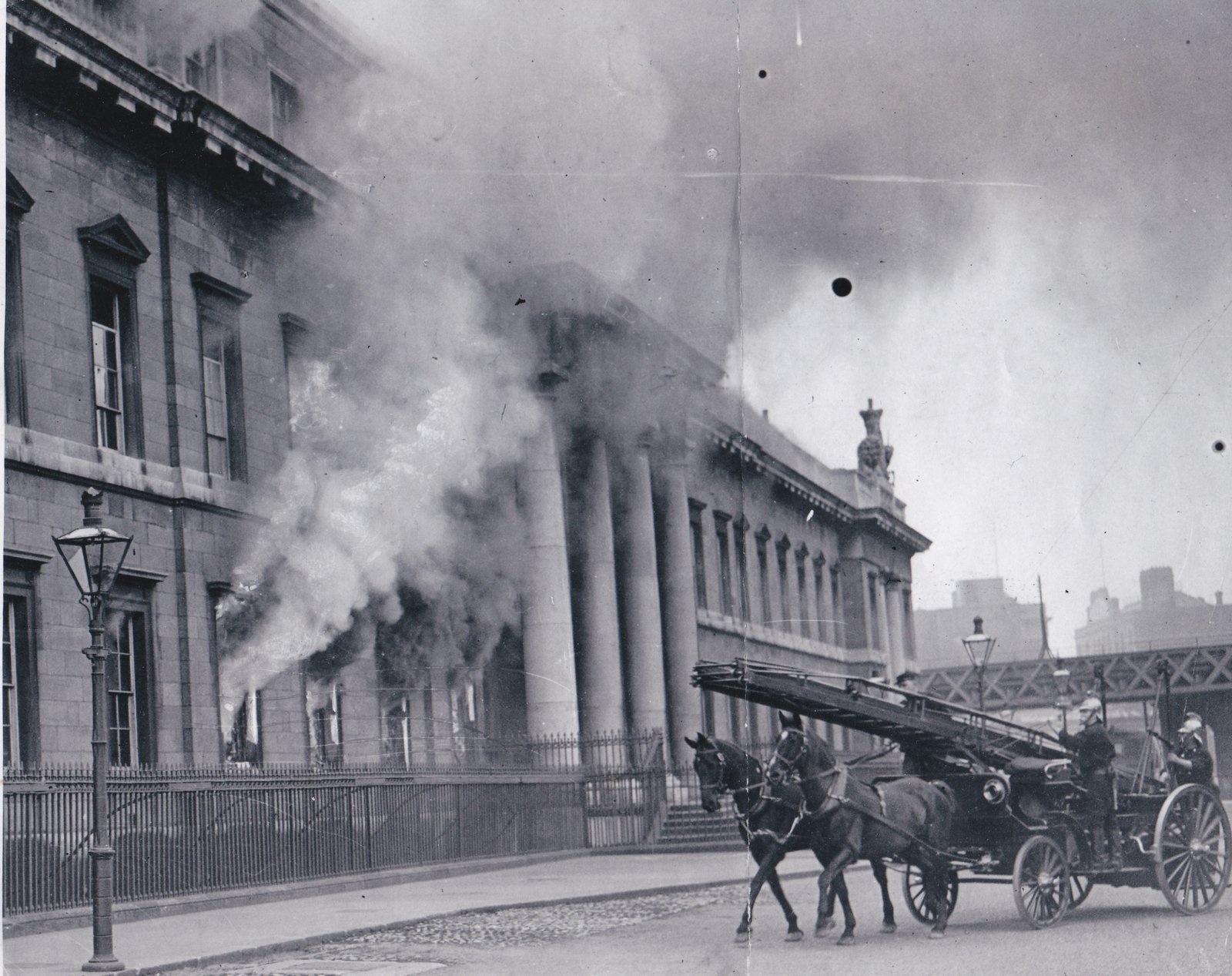 The first units of the Dublin Fire Brigade arriving as the blaze takes hold of the building. Credit: Michael Ward.