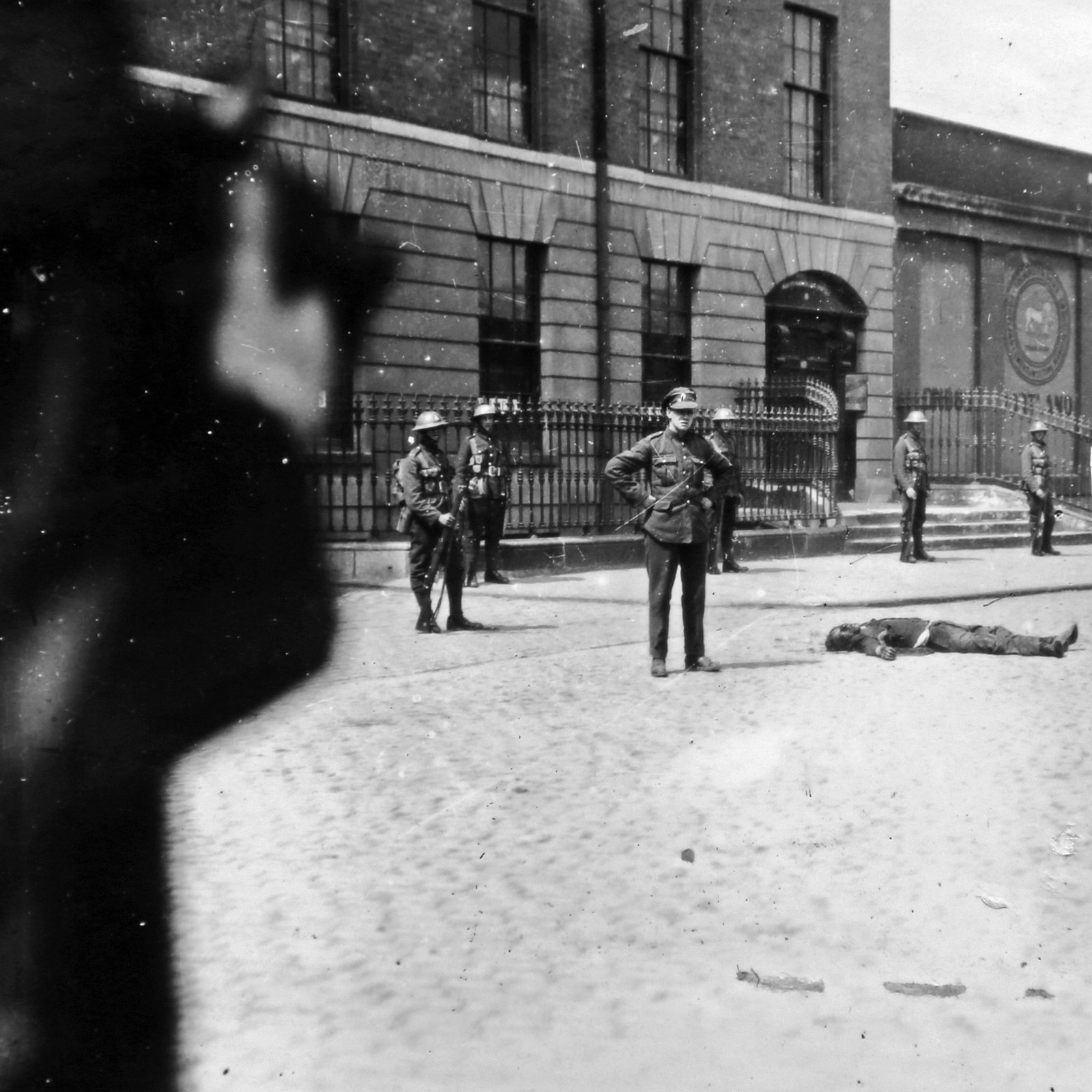 The aftermath: troops and the body of one of the Volunteers killed during the attempted breakout. Credit: Getty images.